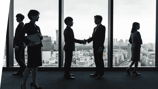握手をするスーツの男性たち